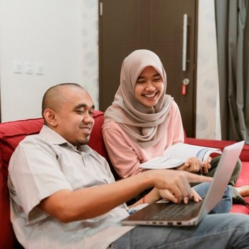 asian young hijab woman studying together with her boy friend