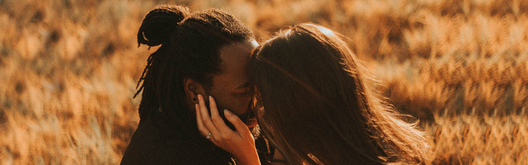 husband and wife kissing